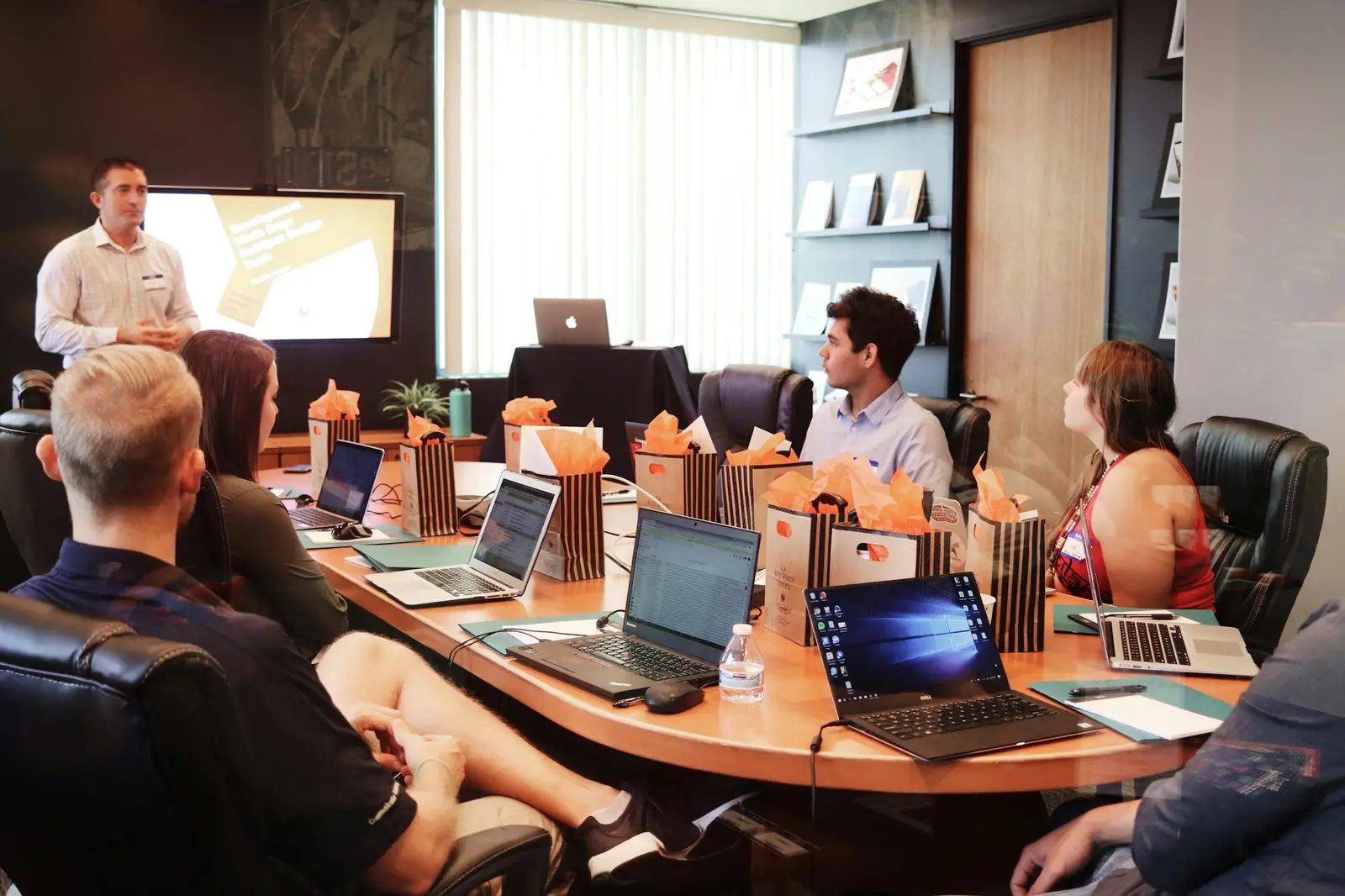 Team members collaborating around a table in the studio