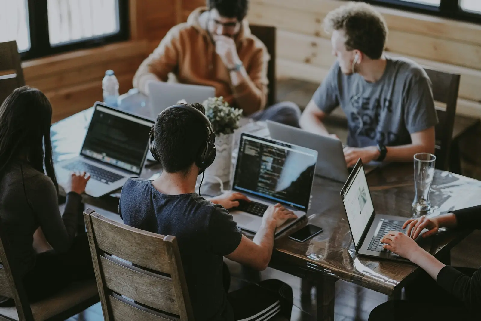 The Redbox team collaborating on laptops in the studio